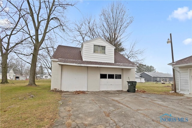 garage with a lawn