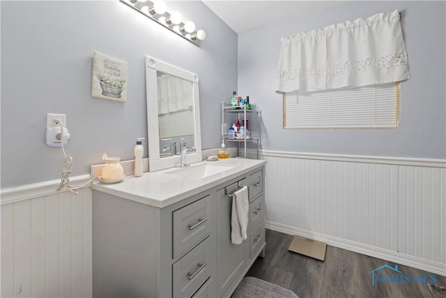 bathroom featuring hardwood / wood-style flooring and vanity