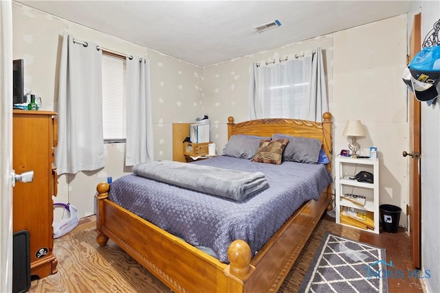 bedroom featuring wood-type flooring