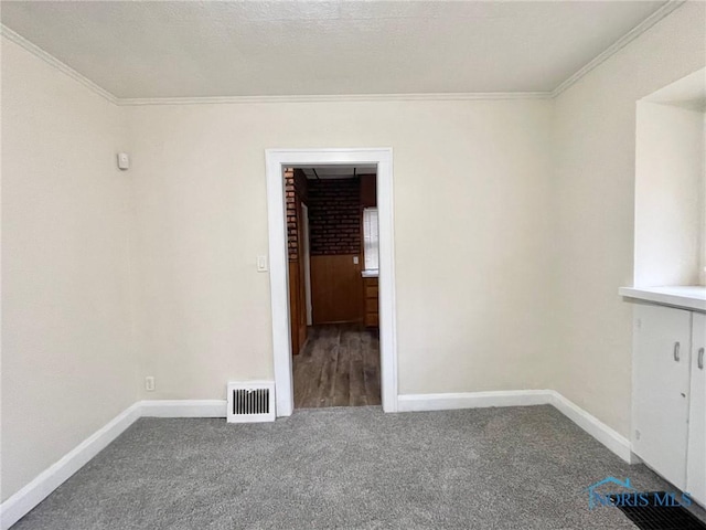 carpeted empty room with ornamental molding