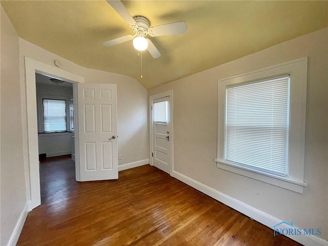 interior space with ceiling fan, hardwood / wood-style floors, and lofted ceiling