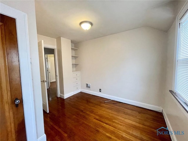 interior space with dark wood-type flooring