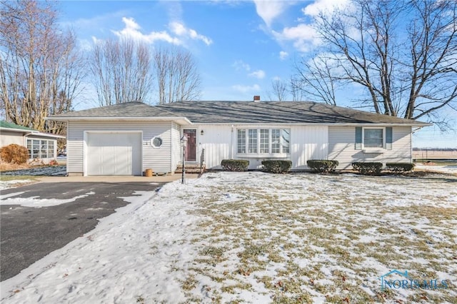 single story home featuring a garage