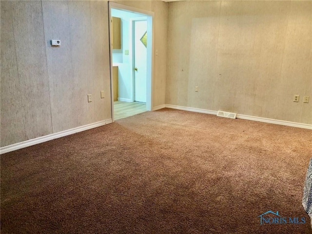 empty room with carpet flooring