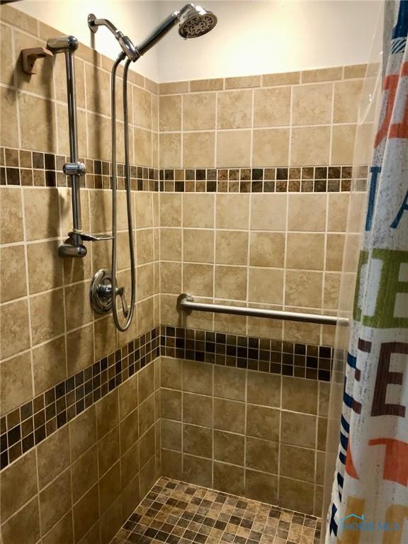 bathroom with a shower with curtain