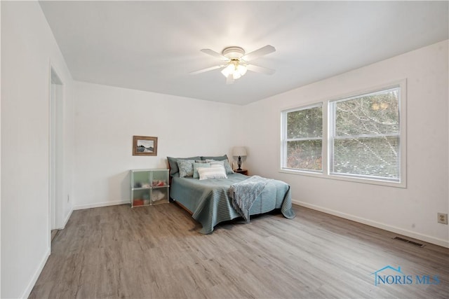 bedroom featuring light hardwood / wood-style flooring and ceiling fan