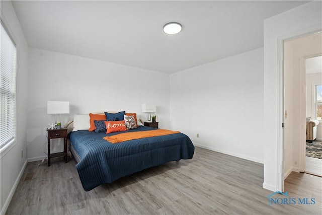 bedroom featuring light wood-type flooring