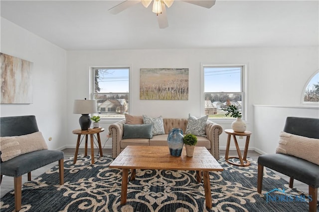 sitting room featuring ceiling fan and a wealth of natural light