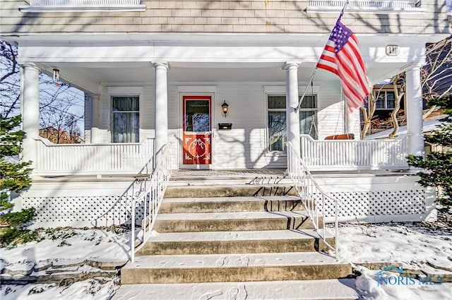 doorway to property with a porch