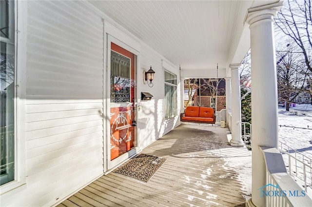 view of snow covered deck