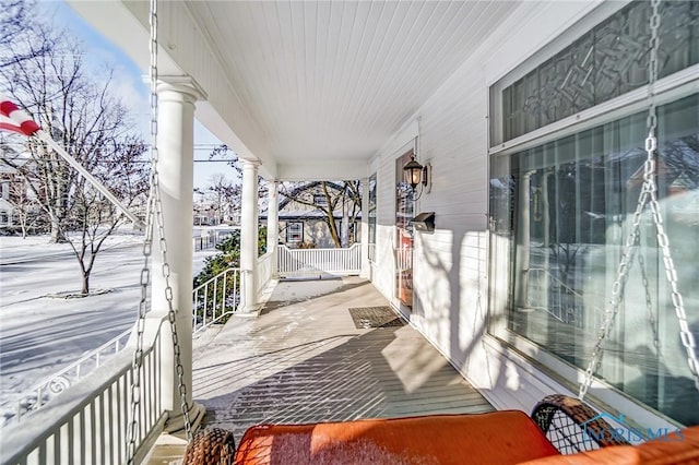 view of snow covered deck