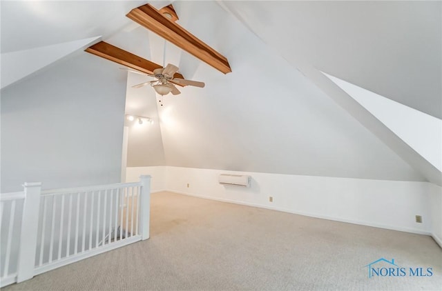 additional living space with light carpet and vaulted ceiling with beams