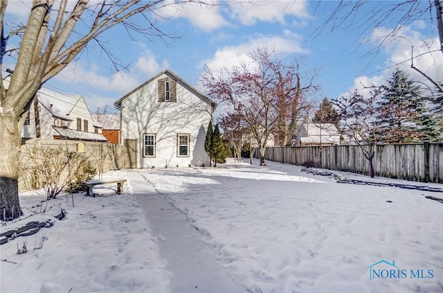 view of snow covered house