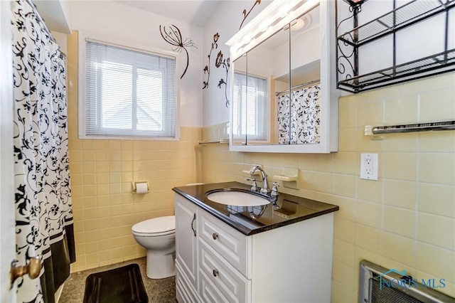 bathroom featuring a shower with curtain, toilet, tile walls, and vanity