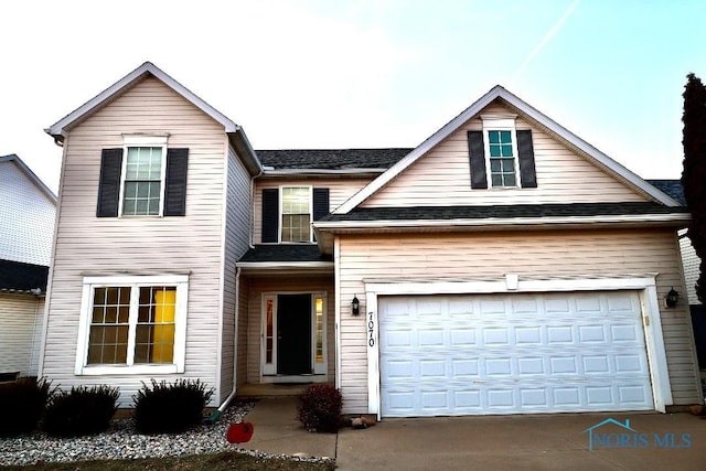 view of property with a garage