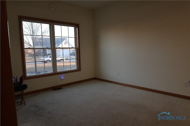 view of carpeted spare room