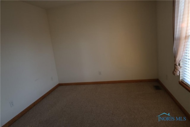 spare room featuring carpet flooring