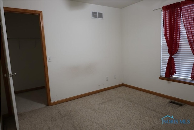 empty room with carpet flooring