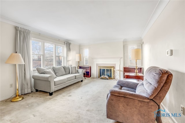 carpeted living room with ornamental molding