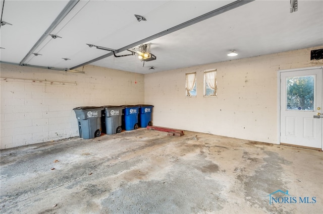 garage featuring a garage door opener