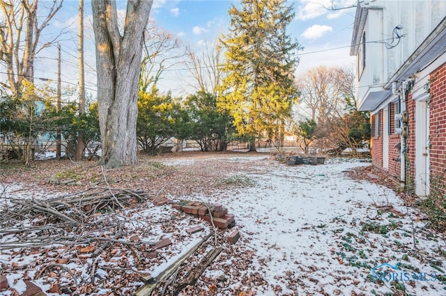 view of yard covered in snow