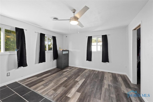 spare room featuring dark hardwood / wood-style floors and ceiling fan