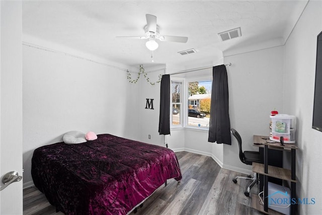 bedroom featuring ceiling fan and wood-type flooring