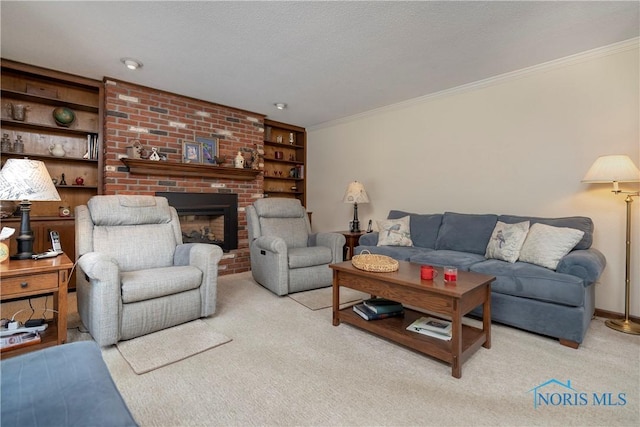 carpeted living room with built in shelves, a brick fireplace, ornamental molding, and a textured ceiling