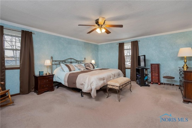 carpeted bedroom featuring crown molding, a textured ceiling, and ceiling fan