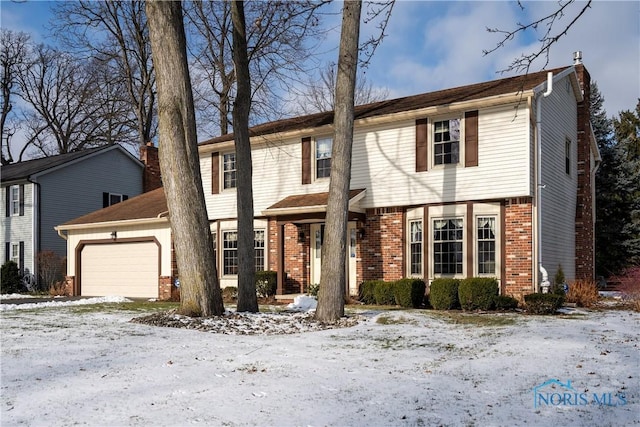 colonial home featuring a garage