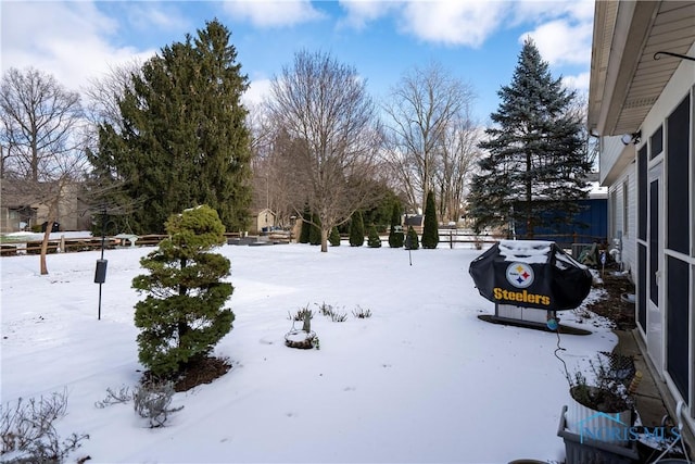 view of yard covered in snow