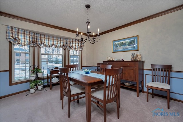 carpeted dining space featuring a notable chandelier, crown molding, and a textured ceiling