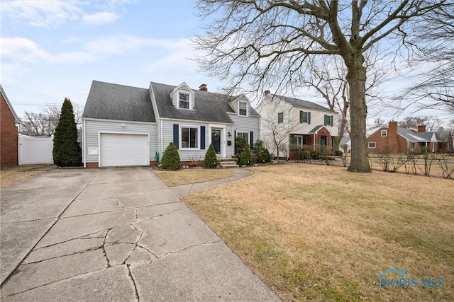 cape cod house with a garage and a front yard