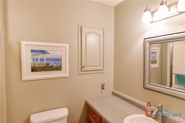 bathroom with vanity and toilet