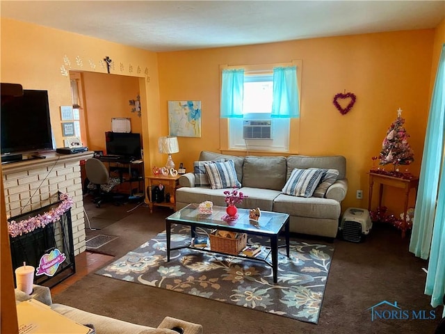 carpeted living room with a fireplace and cooling unit