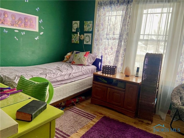 bedroom featuring light wood-type flooring