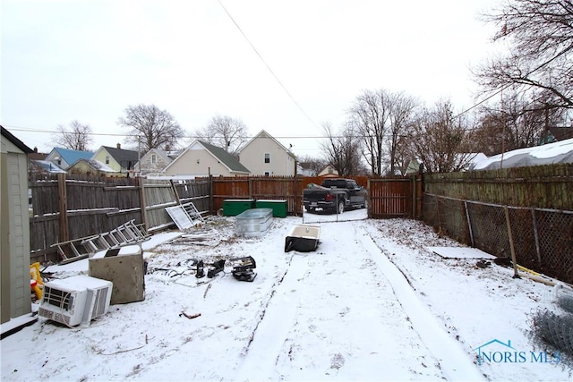 view of yard layered in snow