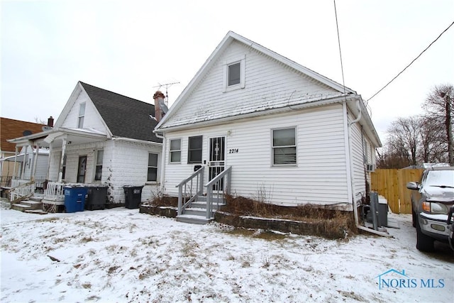 view of snow covered house