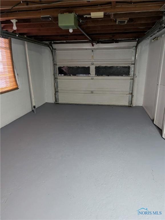 garage featuring a garage door opener