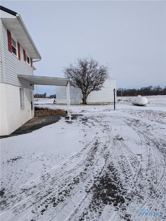 view of yard covered in snow