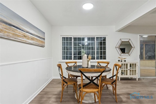 dining area with wood-type flooring