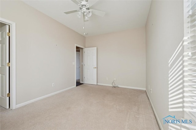 unfurnished bedroom featuring light colored carpet and ceiling fan