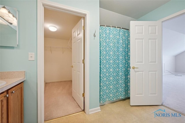 bathroom with vanity and a shower with curtain