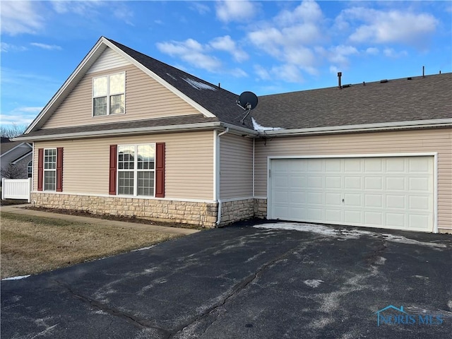 view of side of home with a garage