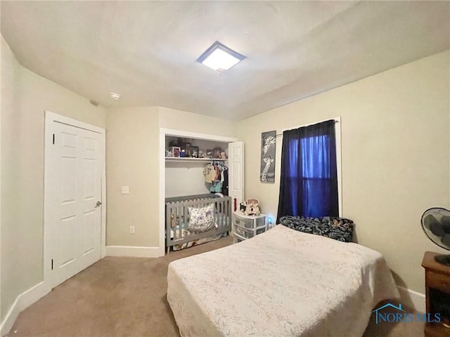 bedroom featuring a closet and carpet