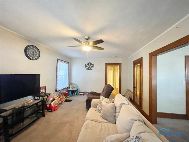 carpeted living room featuring crown molding and ceiling fan