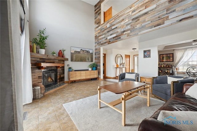 living room featuring a high ceiling and light tile patterned floors