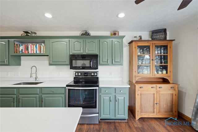 kitchen featuring sink, dark wood-type flooring, ceiling fan, a textured ceiling, and stainless steel electric range oven