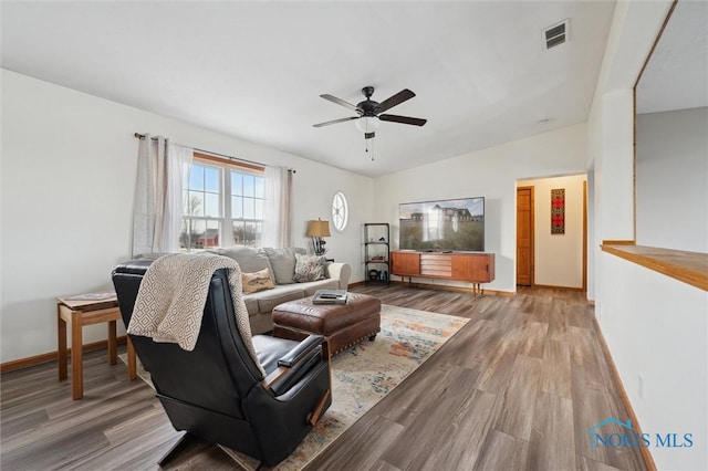 living room with ceiling fan and light hardwood / wood-style floors