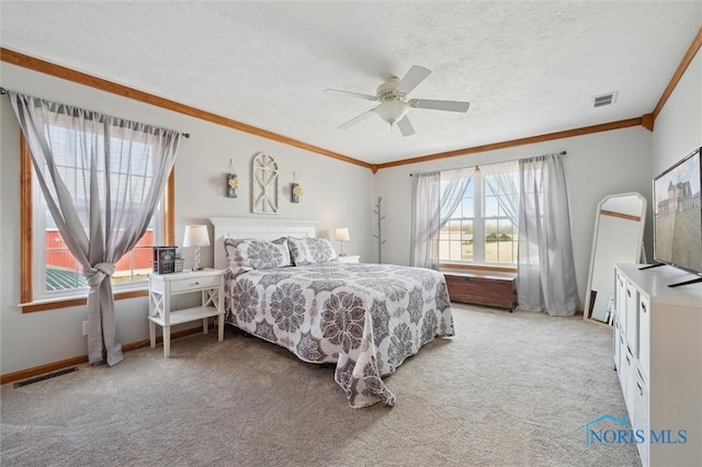 bedroom featuring crown molding, light colored carpet, and ceiling fan